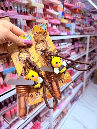 Lip gloss Honey com chaveiro e Acessórios de celular Femme Paris