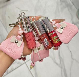 LIP GLOSS COM CHAVEIRO LOVE RAIN CORES SEPARAR QUE ESTEVEM DISPONIVEIS